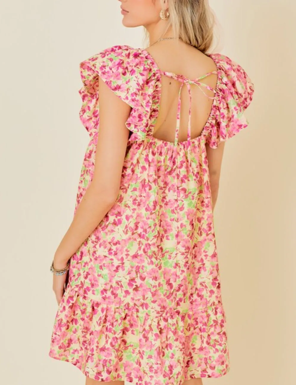 Butter Pink floral mini dress with tie back and ruffle sleeves and side pockets