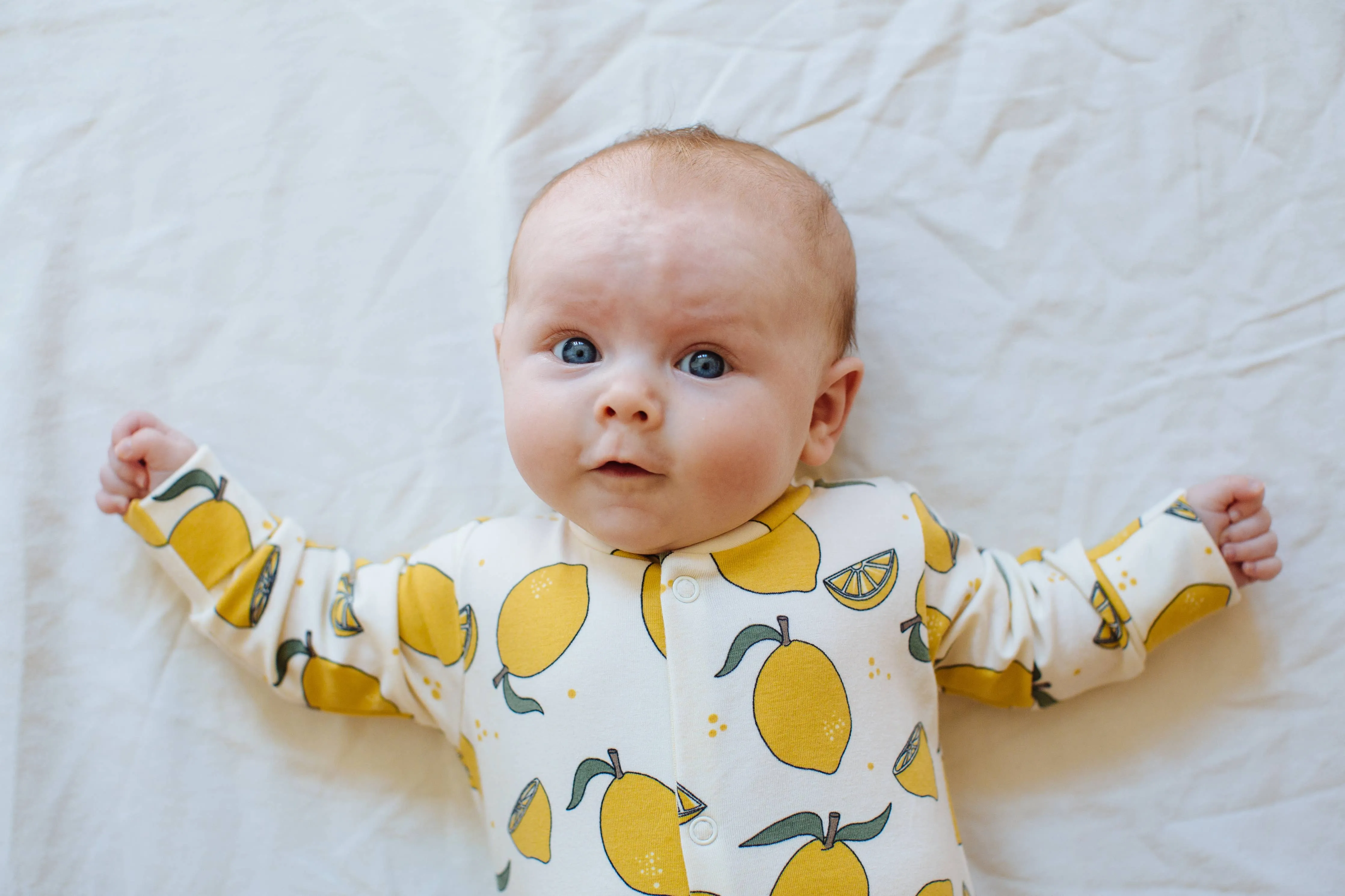 Organic cotton Baby sleepsuit  in Cream with Lemon print - Eddie & Bee