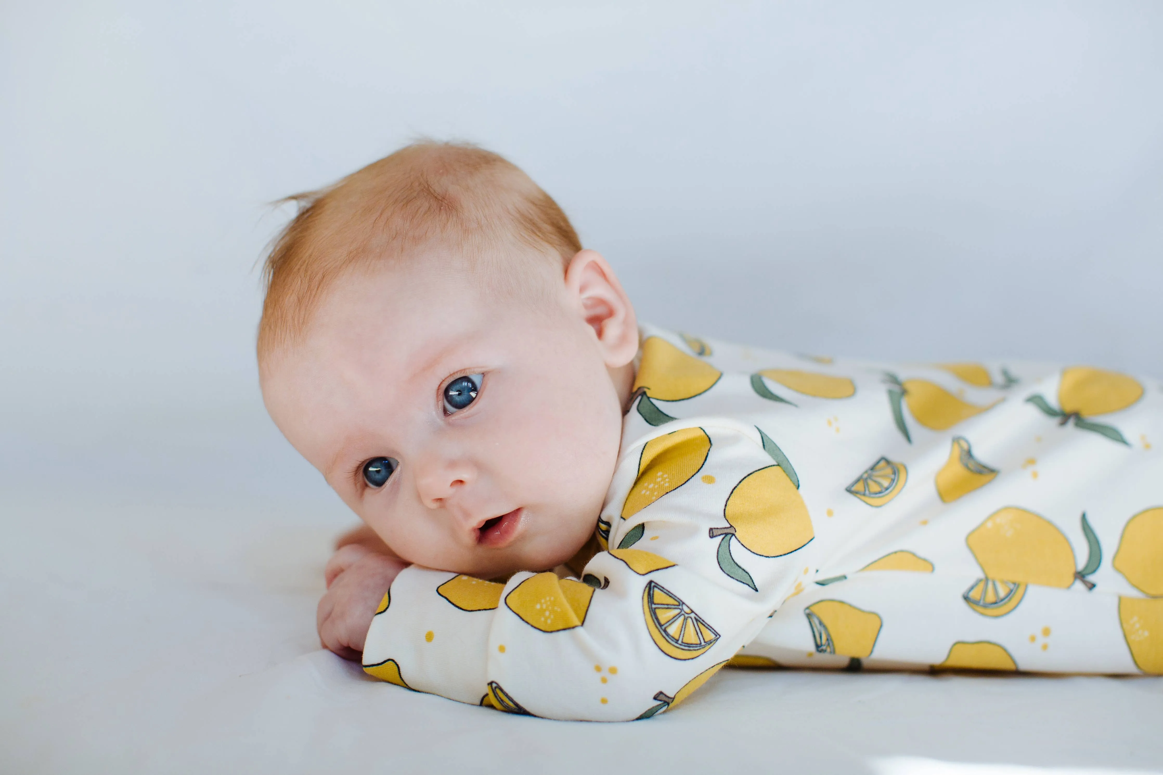 Organic cotton Baby sleepsuit  in Cream with Lemon print - Eddie & Bee