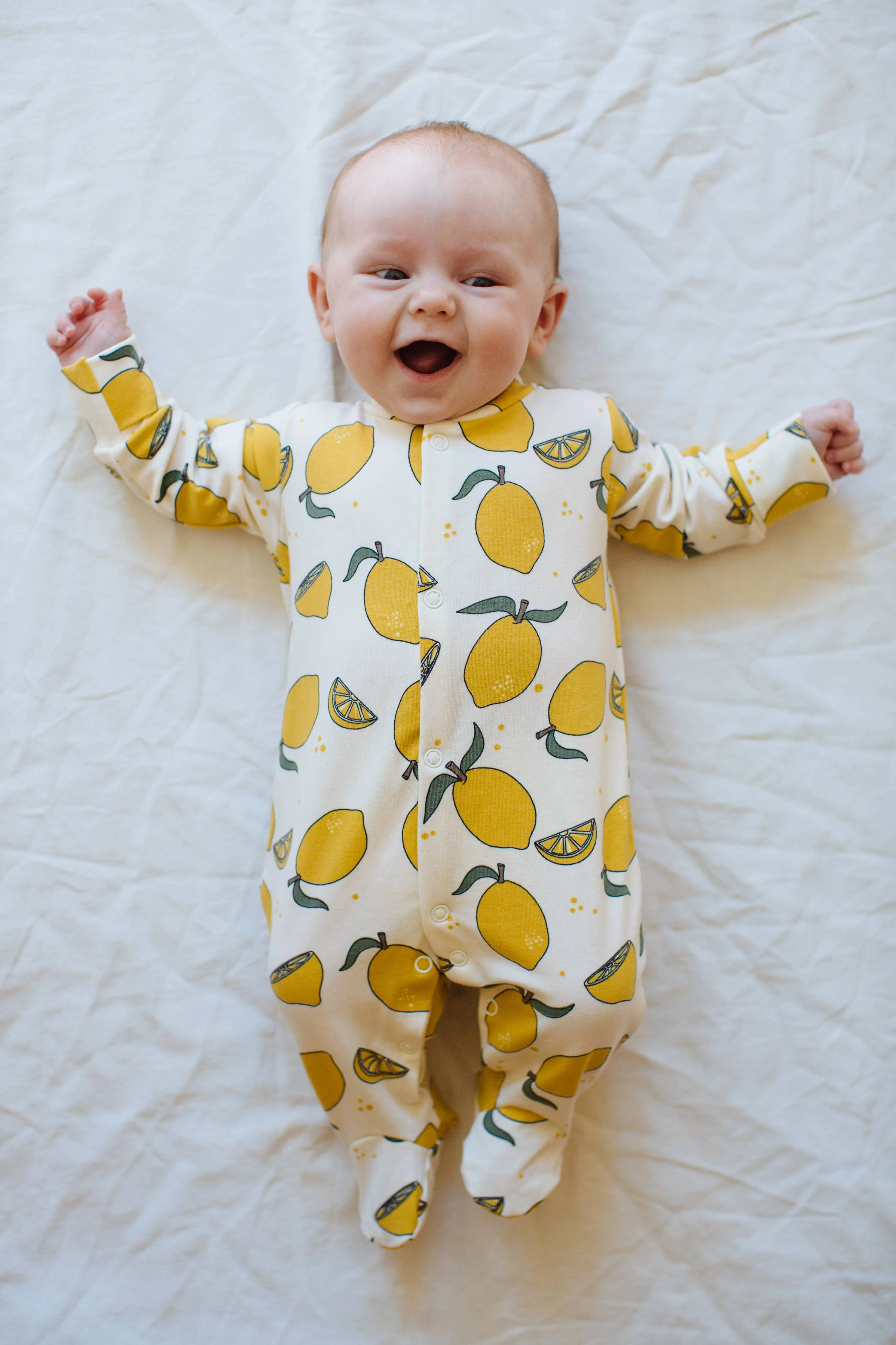 Organic cotton Baby sleepsuit  in Cream with Lemon print - Eddie & Bee