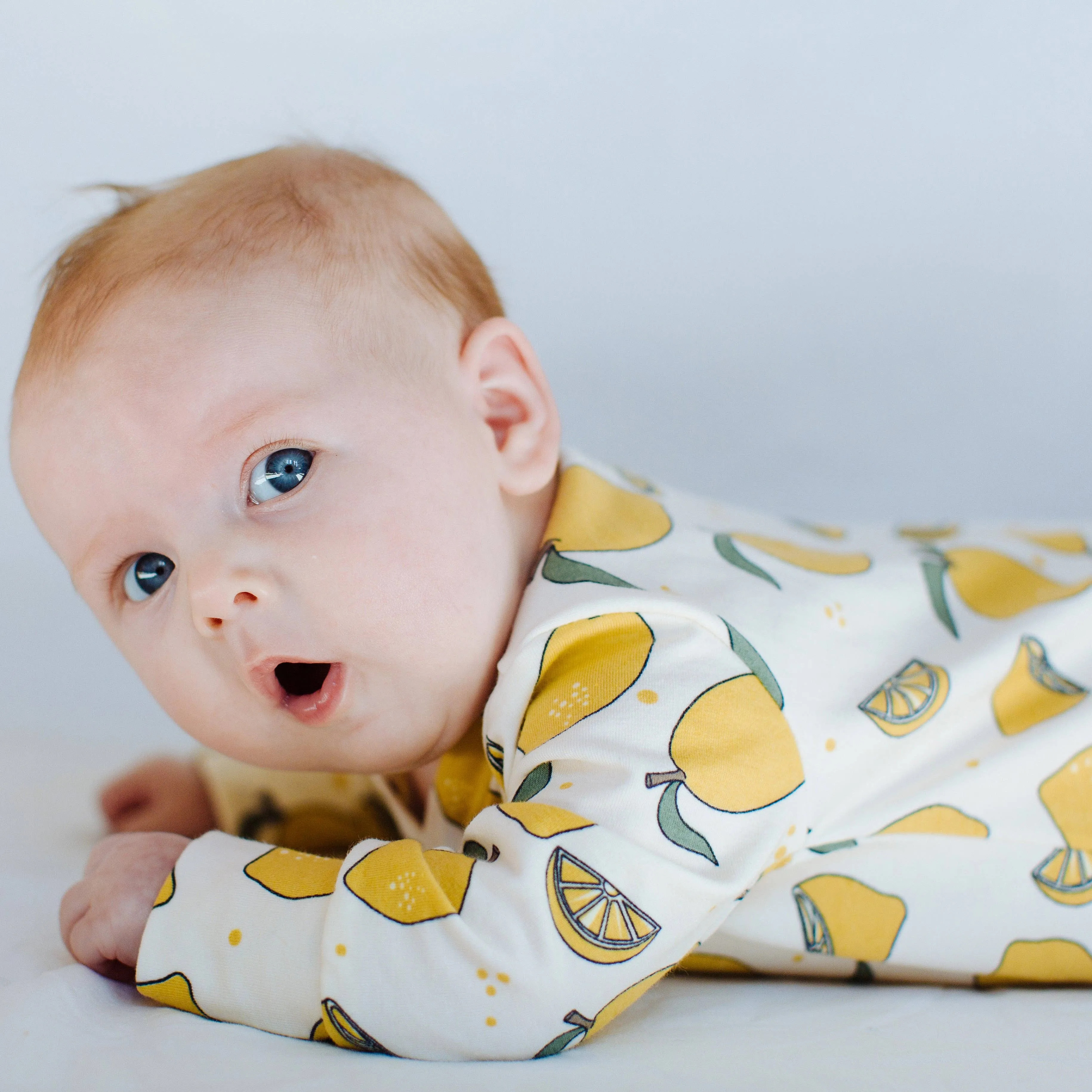 Organic cotton Baby sleepsuit  in Cream with Lemon print - Eddie & Bee